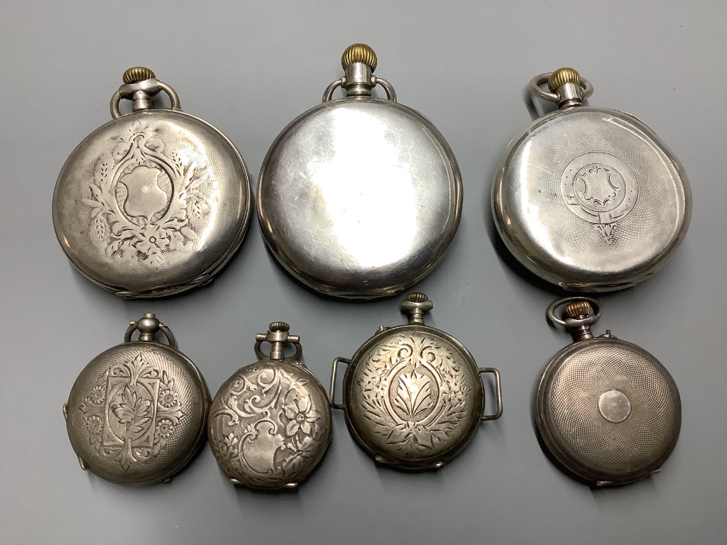 A silver half hunter pocket watch and six other white metal pocket or fob watches